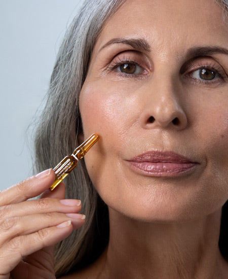 Woman Holding Multi-Vitamin Hydra Boost Ampoule