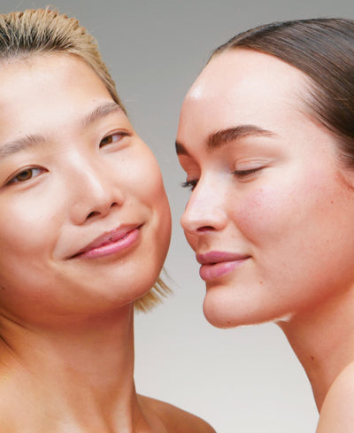 2 Women Smiling In Embrace