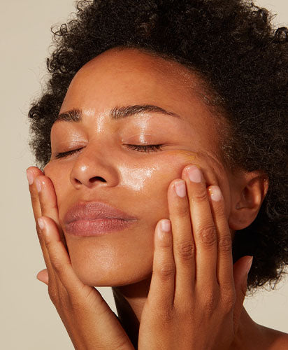 Woman Stimulating Collagen Production On Her Skin