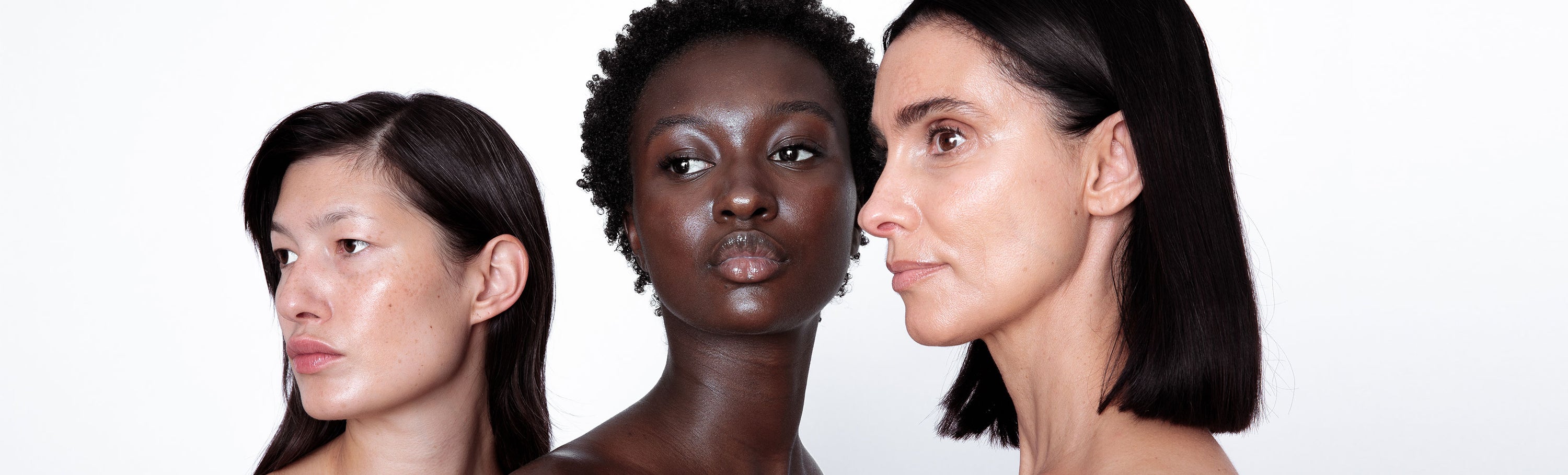 Three Women Looking Across With Great Skin