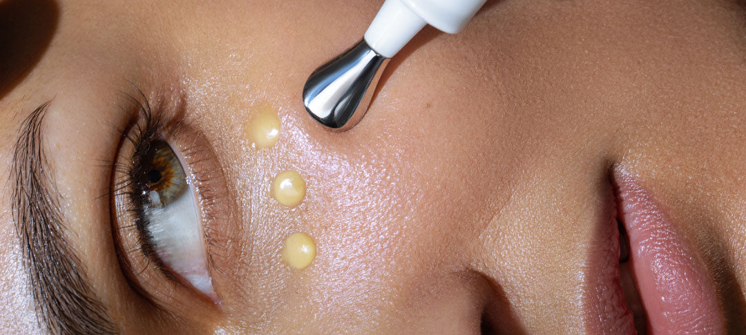 Woman Applying Eye Cream Under Eyes